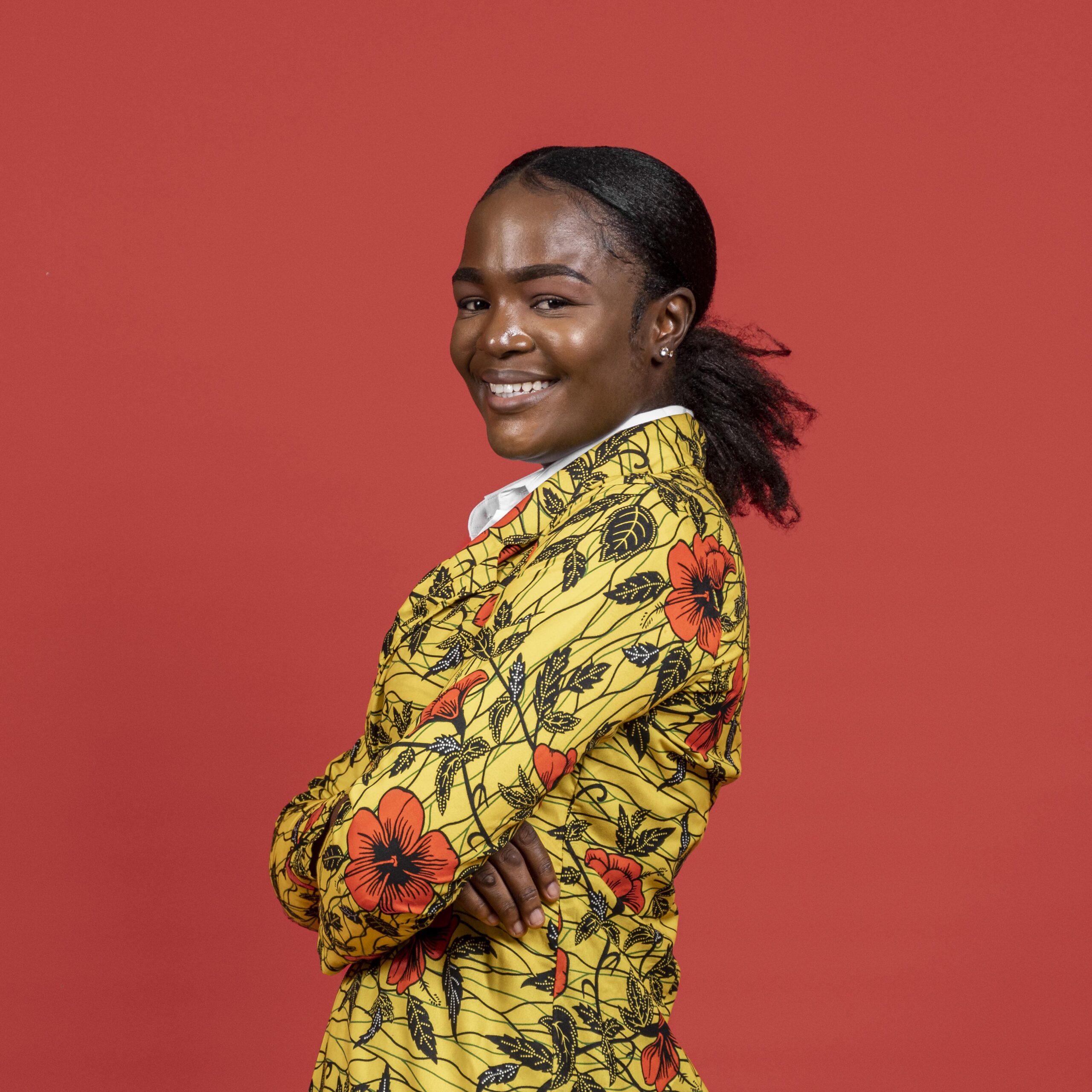 portrait-smiley-african-woman-floral-coat